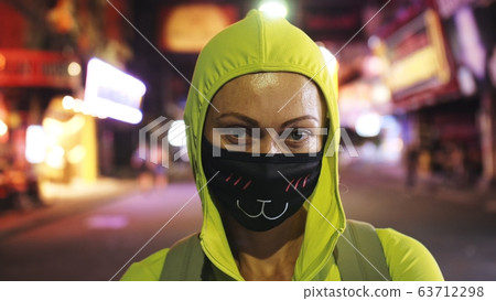 Woman close up look caucasian at Pattaya Walking Street with wearing protective medical mask. Lockdown quarantine isolation. Coronavirus covid-19. Woman close up look caucasian at Pattaya Walking Street with wearing protective medical mask. Lockdown quarantine isolation. Coronavirus covid-19. 63712298