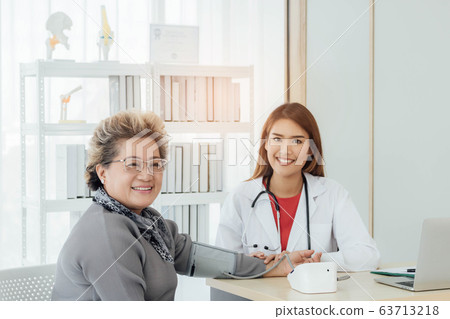 Asian doctor working in the office and discussing  63713218