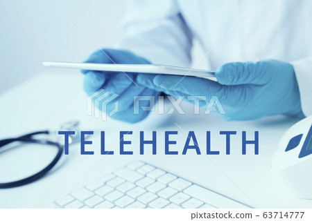 doctor man using a tablet and text telehealth 63714777