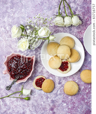 Homemade delicious cookies serving with raspberry jam,top view Homemade delicious cookies serving with raspberry jam,top view 63716757