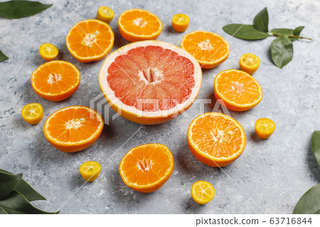 Citrus background with assorted fresh-citrus fruits,lemon,orange,lime,mandarin,kumquat,grapefruit fresh and colorful,top view Citrus background with assorted fresh-citrus fruits,lemon,orange,lime,mandarin,kumquat,grapefruit fresh and colorful,top view 63716844