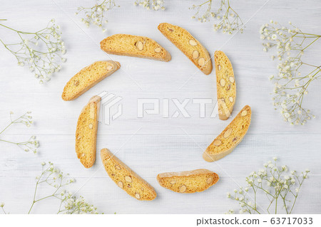 Italian tuscan traditional cookies cantuccini with almonds ,a cup of coffee on light background,top view 63717033