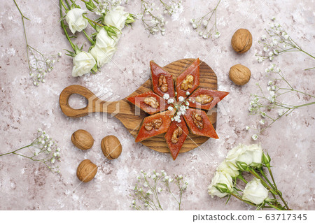 Azerbaijan national pastry pakhlava on white plate on light background ,top view,spring new year celebration Novruz holiday. 63717345