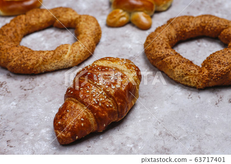 Various sweet buns on brown concrete background,top view 63717401