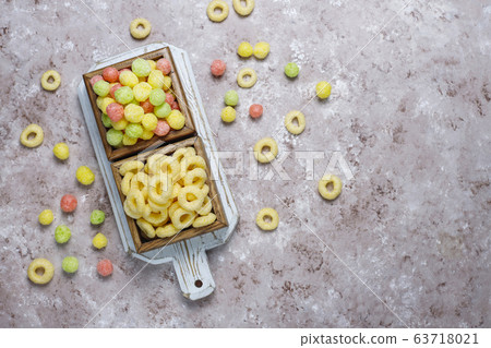 Various corn flakes in wooden boxes on concrete background Various corn flakes in wooden boxes on concrete background 63718021