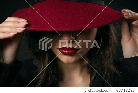Beauty hiding face under hat Beauty hiding face under hat 63718282