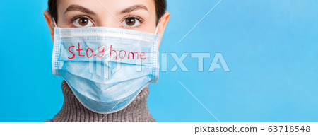 Portrait of young woman wearing medical mask at Portrait of young woman wearing medical mask at 63718548