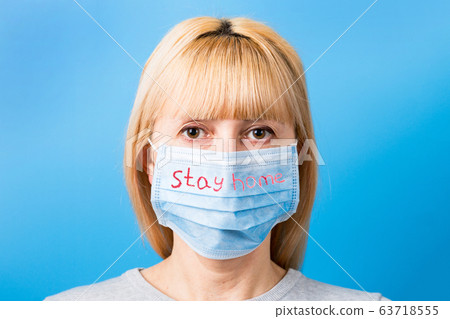Portrait of woman wearing medical mask with Stay 63718555