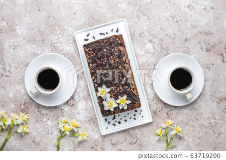 Tasty homemade chocolate truffle cake with coffee on light background Tasty homemade chocolate truffle cake with coffee on light background 63719200