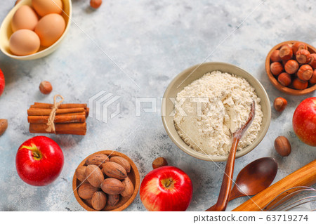 Baking concept of autumn apple pie. View from above on kitchen table. Cooking baking process with ingredients. 63719274