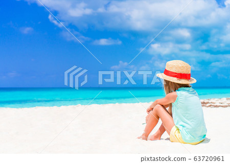 Adorable little girl have fun at tropical beach during vacation Adorable little girl have fun at tropical beach during vacation 63720961
