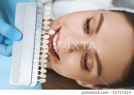 Young woman taking care of teeth stock photo 63721414