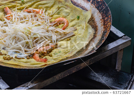 Sizzling crispy shrimp pan cake- Banh Xeo, Vietnamese street food Sizzling crispy shrimp pan cake- Banh Xeo, Vietnamese street food 63721667