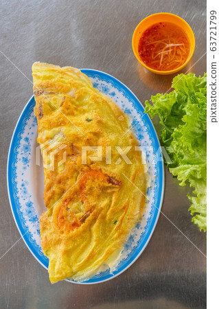 Vietnamese street food- fried pancake stuffed with shrimp and pork Vietnamese street food- fried pancake stuffed with shrimp and pork 63721799