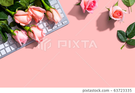 Computer keyboard with pink roses 63723335