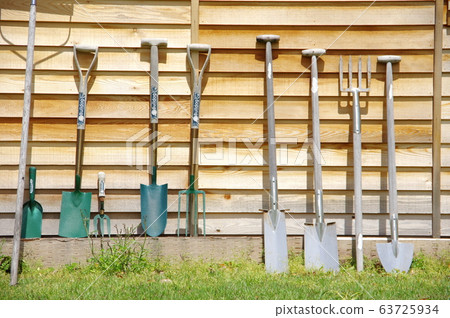 Shovel/Scoop leaning against a wall 63725934