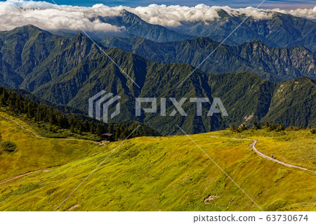 View of mountain climbers and Mt.Ogenta on the ridgeline of Mt. View of mountain climbers and Mt.Ogenta on the ridgeline of Mt. 63730674