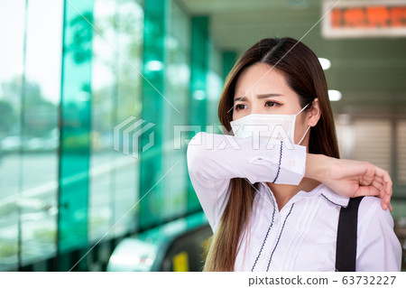 Asian woman cough with mask 63732227