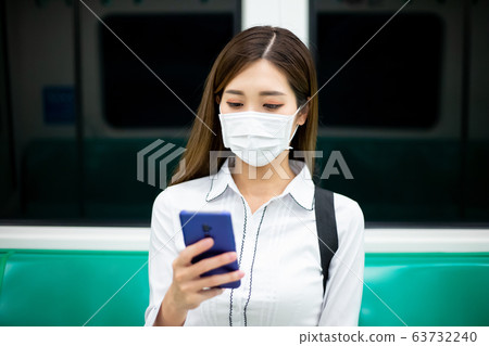 woman with mask in mrt woman with mask in mrt 63732240