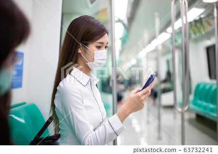 woman with mask in mrt woman with mask in mrt 63732241