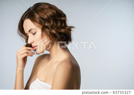 Attractive young female person being deep in thoughts Attractive young female person being deep in thoughts 63735327