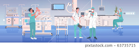 midwife in uniform holding newborn baby doctors team working together medicine healthcare midwifery concept modern hospital clinic interior full length horizontal 63735715
