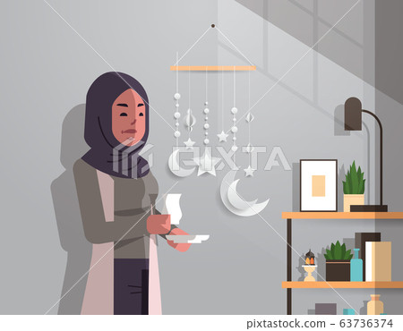 arabic woman in traditional clothes drinking coffee celebrating ramadan kareem holy month modern living room interior flat vertical portrait 63736374