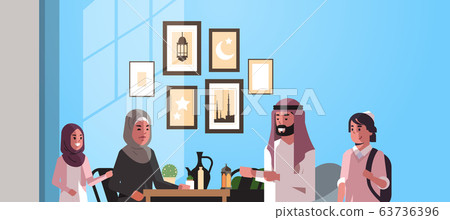 muslim family celebrating ramadan kareem holy month living room interior arabic parents and children in traditional clothes spending time together flat horizontal portrait muslim family celebrating ramadan kareem holy month living room interior arabic parents and children in traditional clothes spending time together flat horizontal portrait 63736396