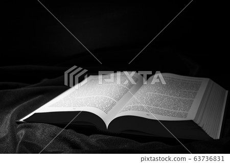 Hardcover book on dark background Hardcover book on dark background 63736831