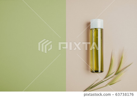 Natural cosmetics, serum for hair and skin care. The concept of organic, natural cosmetics. Flat lay, minimalism, pastel Natural cosmetics, serum for hair and skin care. The concept of organic, natural cosmetics. Flat lay, minimalism, pastel 63738176