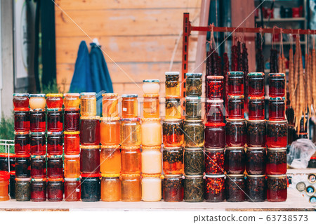 Various Jars With Sweet Tasty Yummy Jams. Jam Made From Walnuts, Pine Cones, Walnuts, Honey. Traditional Healthy Cuisine 63738573