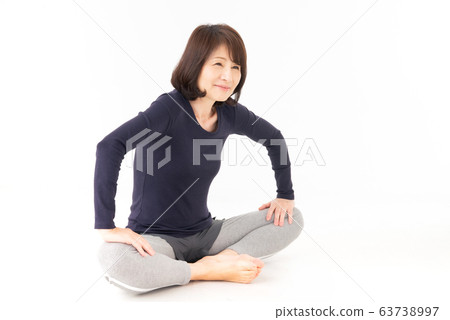 Senior woman stretching Senior woman stretching 63738997
