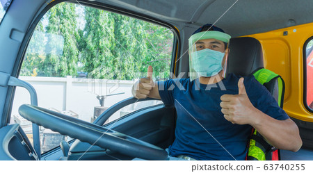 Truck driver wearing a mask Truck driver wearing a mask 63740255