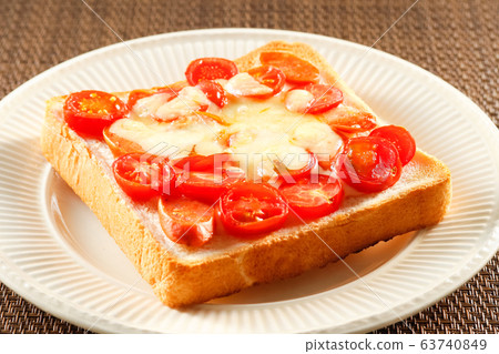 Mini tomato and sausage toast Mini tomato and sausage toast 63740849