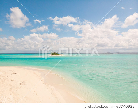 Picture perfect beach and turquoise lagoon on small tropical island on Maldives Picture perfect beach and turquoise lagoon on small tropical island on Maldives 63740923