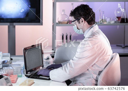 Scientist working in corona virus vaccine development laboratory research facility. 63742576