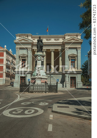 Monument on street in front of building in Madrid Monument on street in front of building in Madrid 63743713