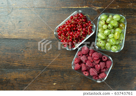 ripe berries in plates 63743761