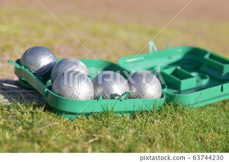 Petanque balls in a box on the grass Petanque balls in a box on the grass 63744230