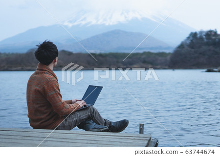 Remote work male back view 63744674