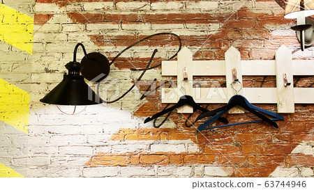 Wooden hangers hang on a hanger 63744946