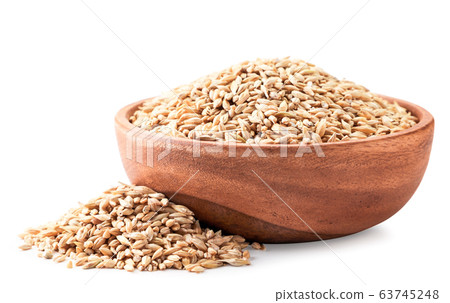 Barley grains in a wooden plate close-up. Isolated Barley grains in a wooden plate close-up. Isolated 63745248