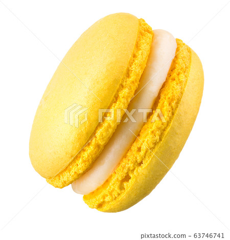 Macro photo of french yellow macaroon isolated on 63746741