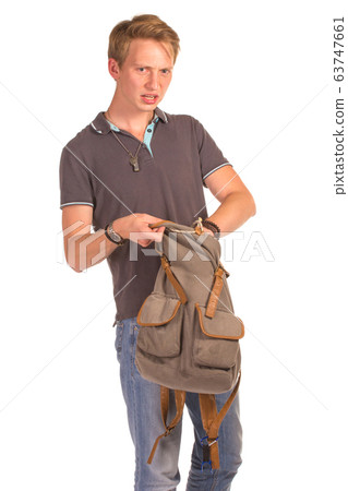 Young shocked student opening his backpack. Young shocked student opening his backpack. 63747661