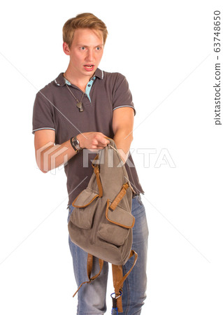 Young shocked student opening his backpack. 63748650