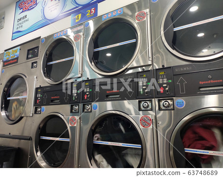 Laundry machines. This outlet provides self-service laundry and drying machines. Open 24 hours. 63748689