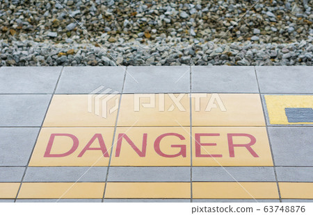 Warning sign for danger on the floor of the train. Warning sign for danger on the floor of the train. 63748876