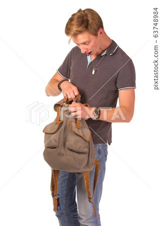 Young shocked student opening his backpack. Young shocked student opening his backpack. 63748984