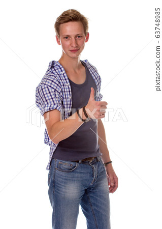 Excited young man showing the thumbs up gesture, Excited young man showing the thumbs up gesture, 63748985