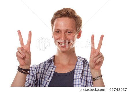 handsome young man showing victory fingers sign 63748987